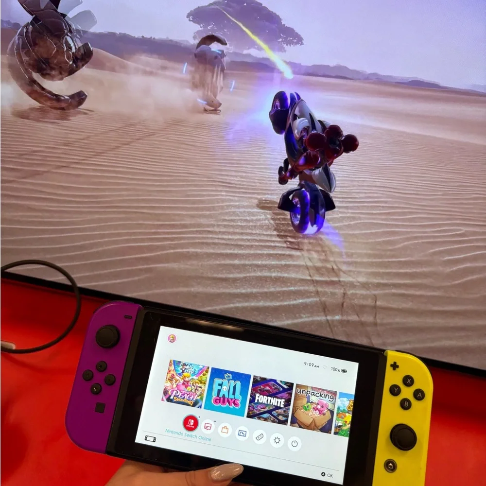 Nintendo Switch with Vibrant Purple and Yellow Joy-Con free games